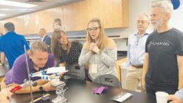 NSU faculty and staff gather in new physics lab.