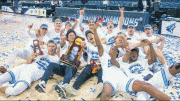 NSU basketball players celebrate after winning the national championship.