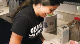 Ashley Trejos, senior management major, creates a strawberry shortcake milkshake for a customer.