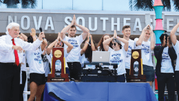 President Hanbury and NSU's men's basketball and women's swim teams celebrate their national championship wins at the Shark Bites: International Food Festival in March.