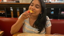 Aleena Vargas, junior paralegal studies major, enjoys a slice of pizza at Blaze Pizza.