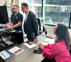 COURTESY OF SCOTT WYMANBella Giaquinto, senior communication major, reviews the weekly schedule with Fort Lauderdale Mayor Dean Trantalis and Zachary Eakins-Durand, community outreach director for the mayor's office. 